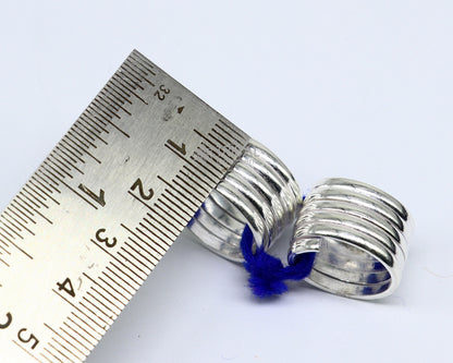 Handmade solid silver spiral toe rings pair with tribal, boho, and belly dance-inspired design by TRIBAL ORNAMENTS.