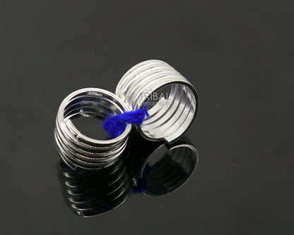 Pair of handmade tribal silver toe rings with spiral design, ideal for boho, belly dance, and hippie jewelry styles.