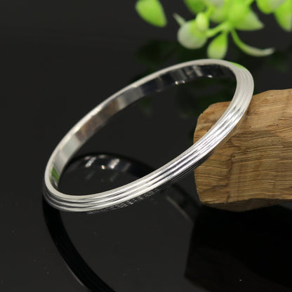 Solid silver Punjabi Sikkha Kada bangle bracelet by Tribal Ornaments, customizable unisex jewelry with intricate traditional design.