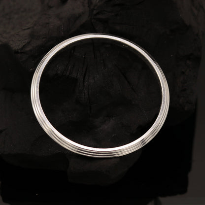 Solid silver Punjabi Sikkha kada bangle bracelet by TRIBAL ORNAMENTS, customizable unisex jewelry with intricate design.