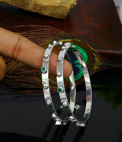 Sterling silver green gemstone bangles bracelet with tribal design, handmade jewelry by TRIBAL ORNAMENTS, stylish and elegant.