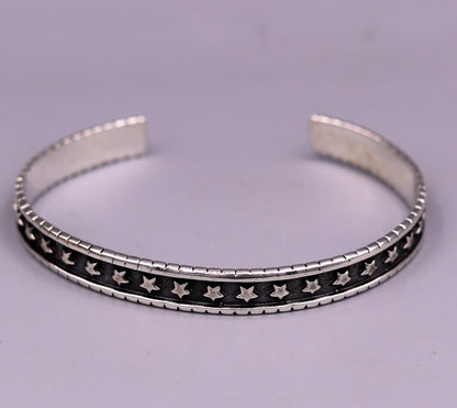 Vintage 925 sterling silver cuff bangle by Tribal Ornaments, adjustable unisex kada bracelet with intricate antique design.