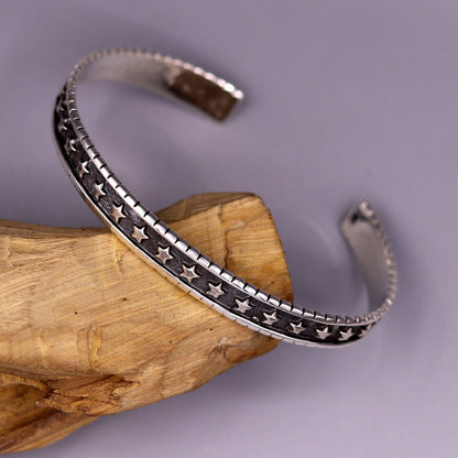 Vintage 925 sterling silver cuff bangle bracelet by Tribal Ornaments, adjustable unisex jewelry with antique design for personalized gifting.