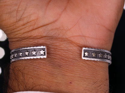 Vintage 925 sterling silver cuff bangle bracelet by Tribal Ornaments, adjustable unisex kada jewelry with intricate antique design.