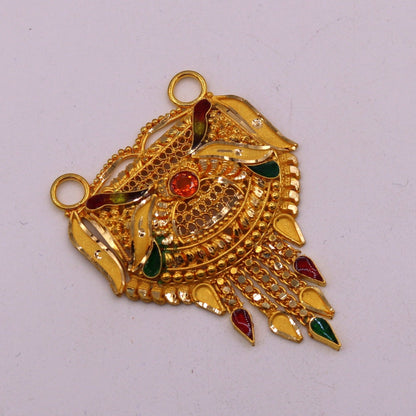 Antique 22KT yellow gold filigree and meenakari tribal pendant with traditional Indian craftsmanship, worn on a necklace.