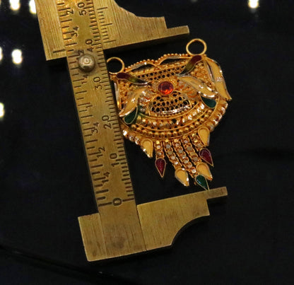 Antique 22KT yellow gold filigree Meenakari pendant with traditional Indian tribal design and intricate craftsmanship.