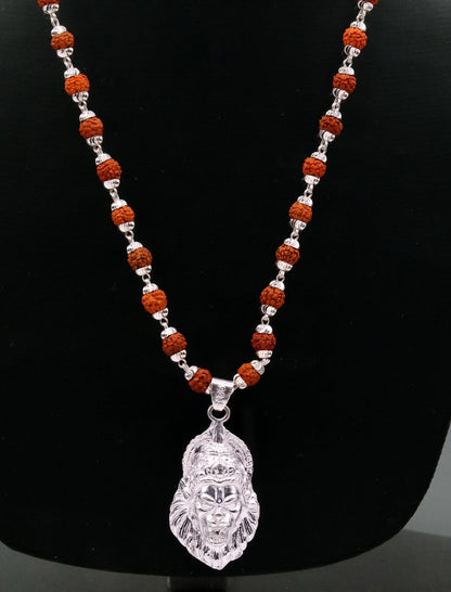 Handmade 925 sterling silver Lord Vishnu avatar Narishma pendant with natural Rudraksha beads in a tribal jewelry set.