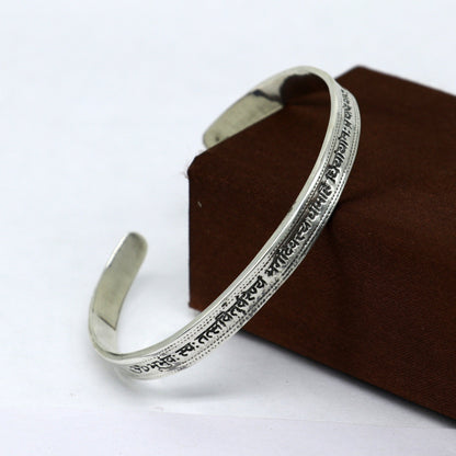 Sterling silver Gayatri Mantra cuff bracelet by Tribal Ornaments, unisex jewelry with adjustable design and intricate mantra detailing.