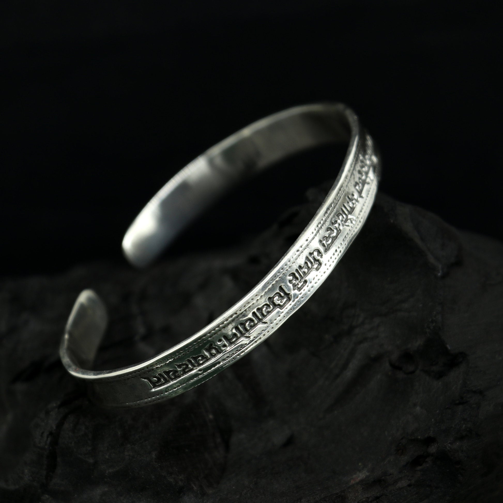 Sterling silver Gayatri Mantra cuff bracelet by Tribal Ornaments, unisex jewelry with adjustable design and engraved mantra detail.
