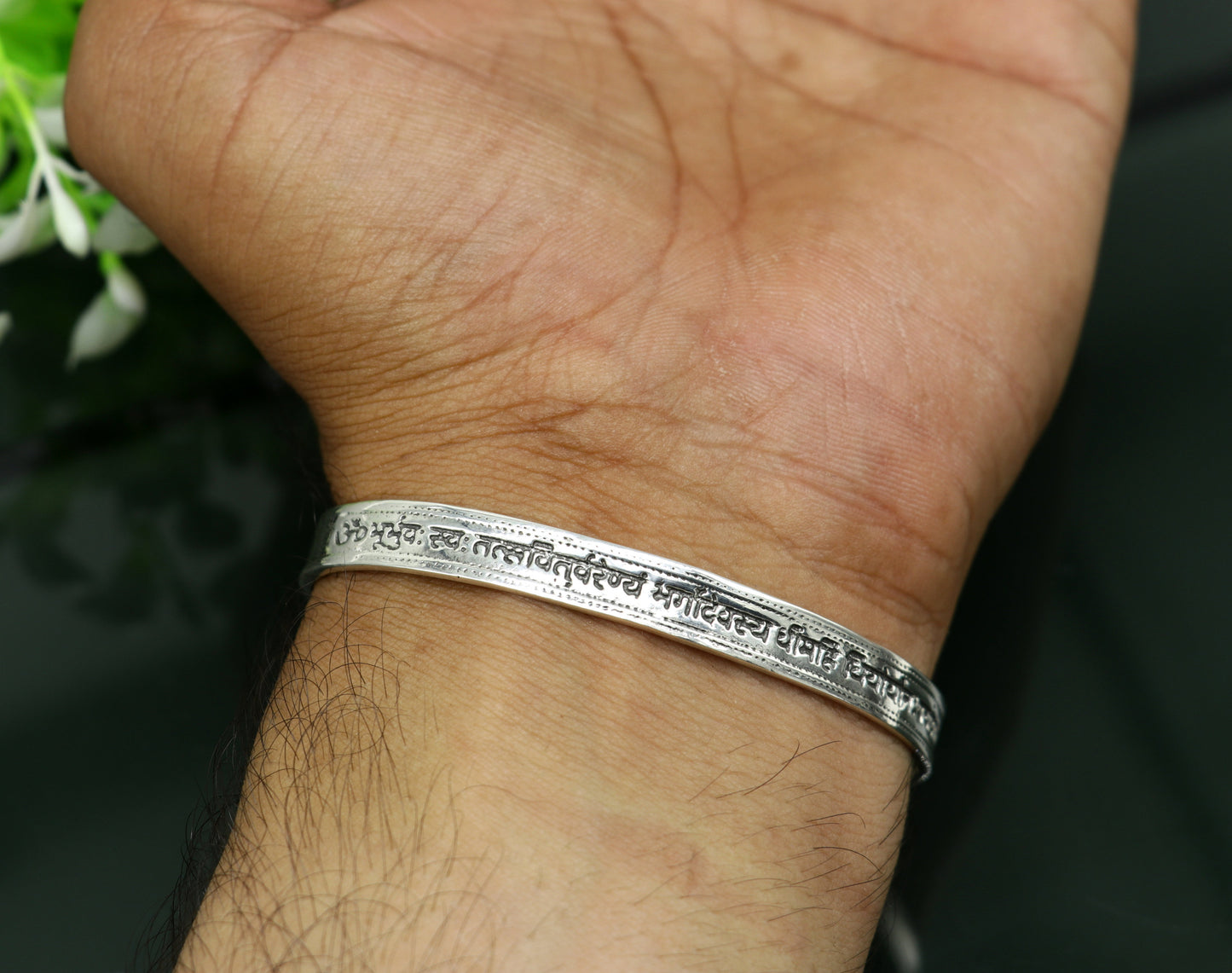 Sterling silver Gayatri Mantra cuff bracelet by Tribal Ornaments, unisex jewelry with intricate engraved design, adjustable fit.