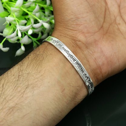 Sterling silver Gayatri Mantra cuff bracelet by TRIBAL ORNAMENTS, unisex jewelry with adjustable design and intricate mantra engraving.