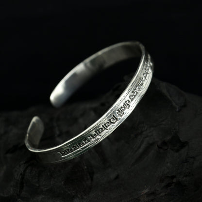 Sterling silver Gayatri Mantra cuff bracelet by TRIBAL ORNAMENTS, unisex design with adjustable fit and intricate mantra engraving.