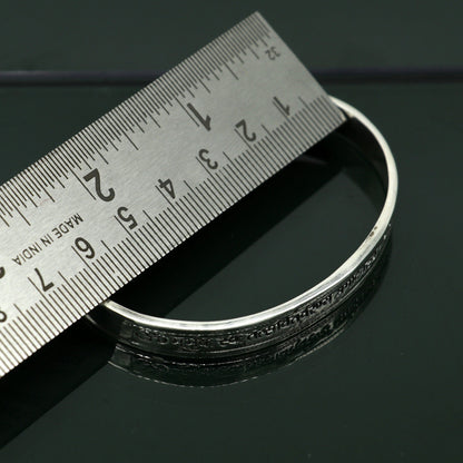 Sterling silver Gayatri Mantra cuff bracelet by TRIBAL ORNAMENTS, unisex jewelry with adjustable design and intricate mantra engraving.
