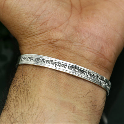 Sterling silver Gayatri Mantra cuff kada bracelet by TRIBAL ORNAMENTS, unisex jewelry with adjustable design and intricate mantra engraving.