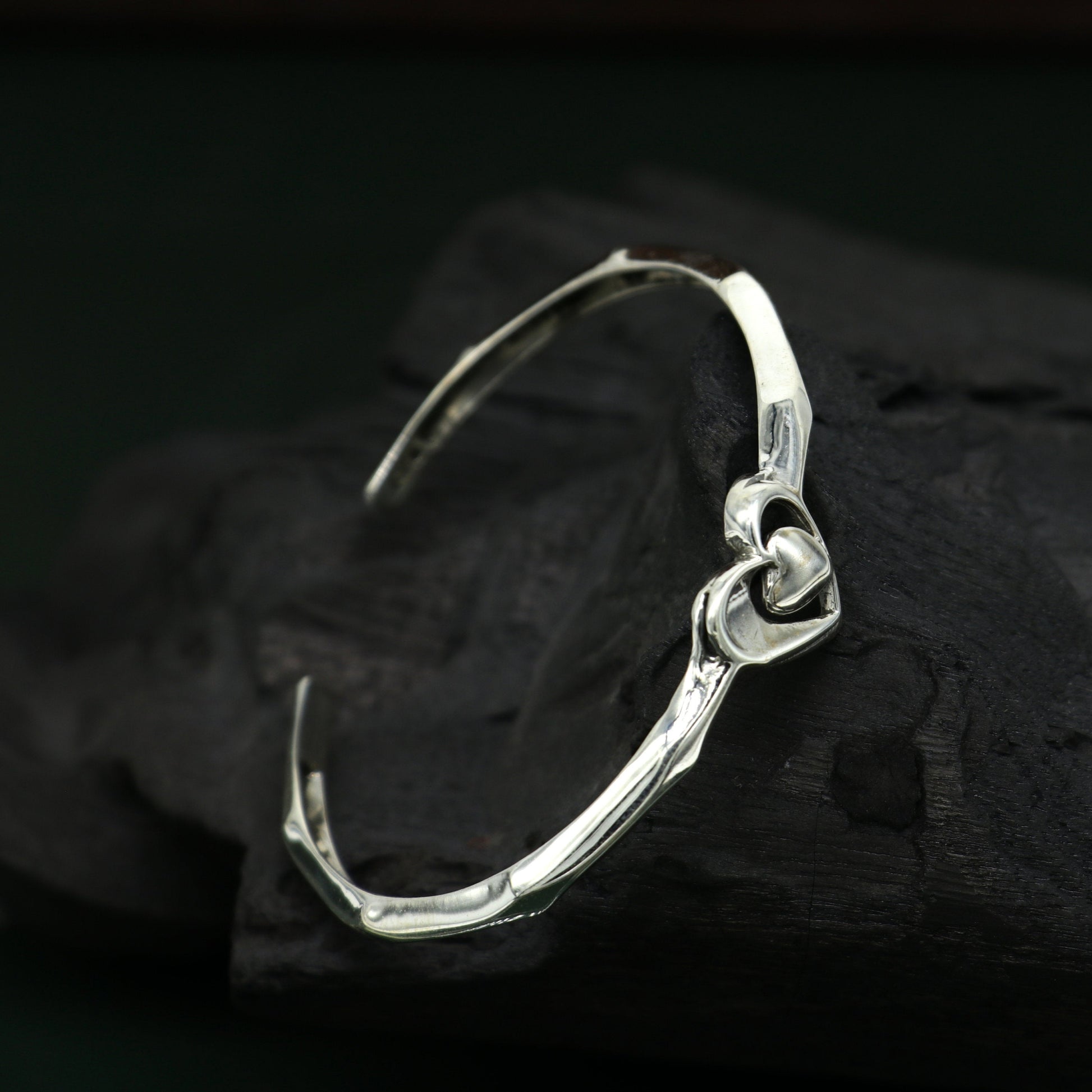 925 sterling silver heart design bangle cuff bracelet by TRIBAL ORNAMENTS, adjustable handmade silver jewelry with intricate heart detail.