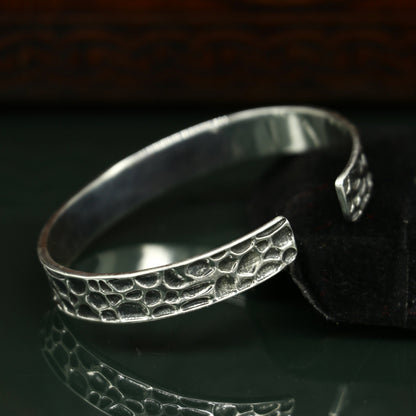 Handmade 925 sterling silver cuff bracelet by Tribal Ornaments, adjustable unisex jewelry with an exclusive tribal design.