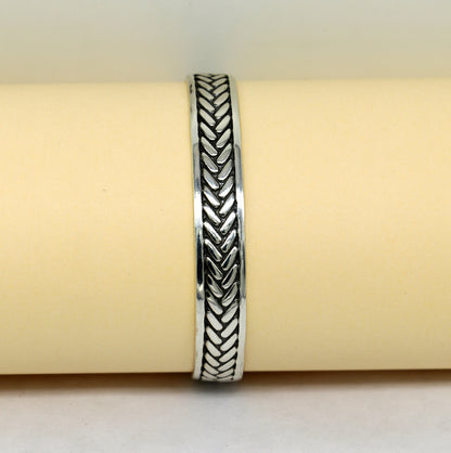 Sterling silver Tiger design cuff bracelet by TRIBAL ORNAMENTS, unisex jewelry with easy adjustable fit and intricate tiger motif.