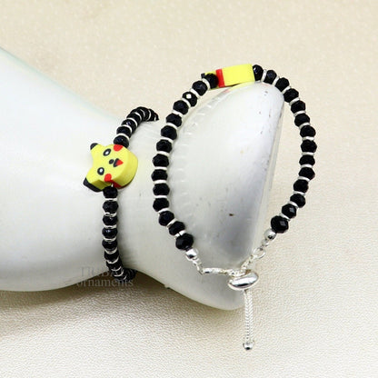 Handmade black beaded bangle or ankle bracelet in 925 sterling silver for kids, custom-designed tribal jewelry by TRIBAL ORNAMENTS.