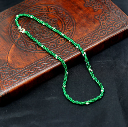 Custom galaxy necklace by TRIBAL ORNAMENTS featuring silver semi-precious green beads on a triple-strand 925 silver chain