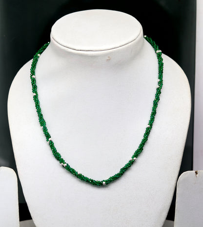 Custom galaxy necklace by TRIBAL ORNAMENTS featuring triple silver strands with green semi-precious beads and silver accents.