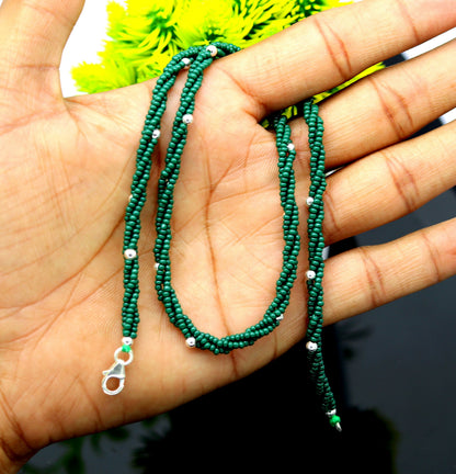 Custom made triple strand necklace with green semiprecious beads and 925 silver beads, featuring a galaxy-inspired design by TRIBAL ORNAMENTS.
