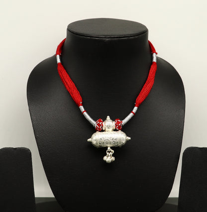 Customized Indian traditional design vintage silver charm necklace with intricate tribal patterns, perfect for brides and wedding jewelry.