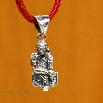 Handmade silver Sai Baba pendant by TRIBAL ORNAMENTS, featuring detailed Indian idol design in 925 sterling silver jewelry.