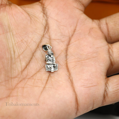 Sterling silver Sai Baba pendant by TRIBAL ORNAMENTS featuring a detailed Indian idol design, personalized blessing jewelry.