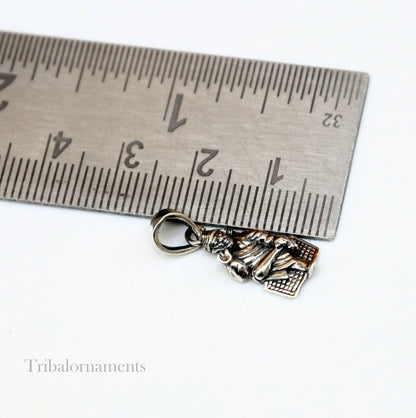 Sterling silver Sai Baba pendant by TRIBAL ORNAMENTS featuring handcrafted Indian idol design, personalized blessing jewelry.