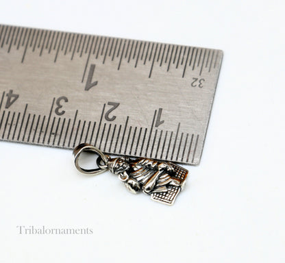 Sterling silver Sai Baba pendant by TRIBAL ORNAMENTS featuring intricate handmade Indian design, personalized blessing jewelry.