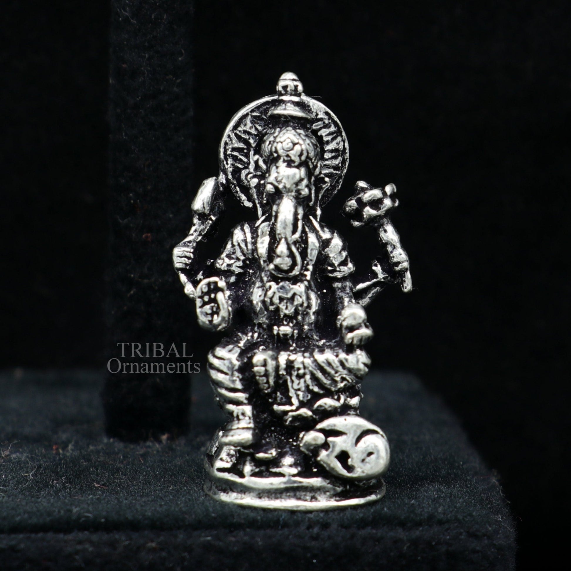 Small Ganesha statue crafted from 925 sterling silver, ideal for home temple or car decor, by TRIBAL ORNAMENTS.