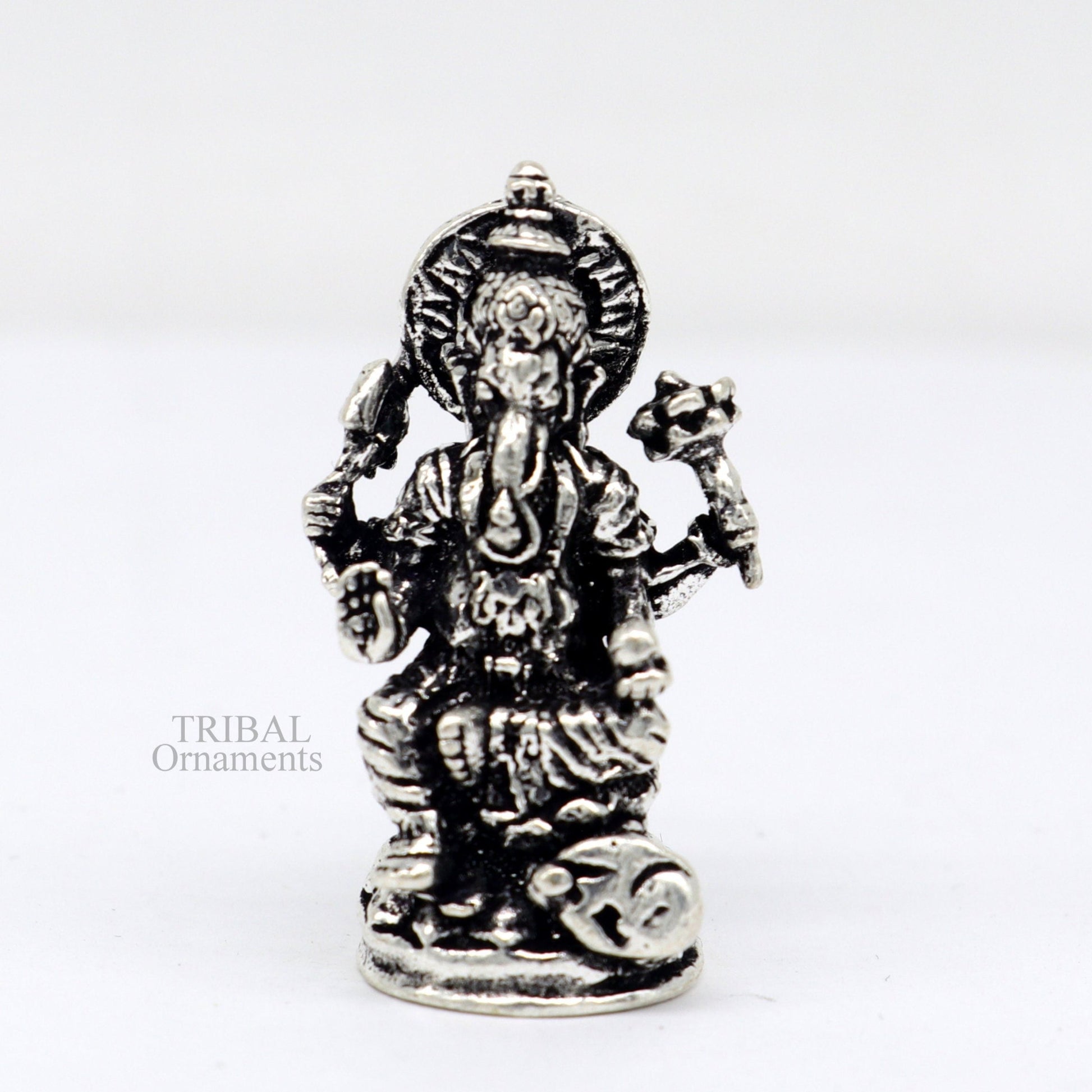 Small Divine Ganesha statue made of 925 sterling silver, ideal for home temple or car puja, from TRIBAL ORNAMENTS.