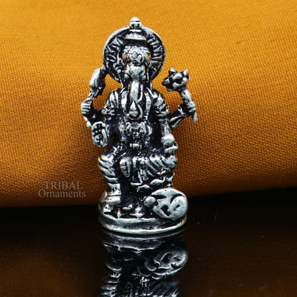 Small Divine Ganesha statue in 925 sterling silver by Tribal Ornaments, ideal for home temple or car puja decor.
