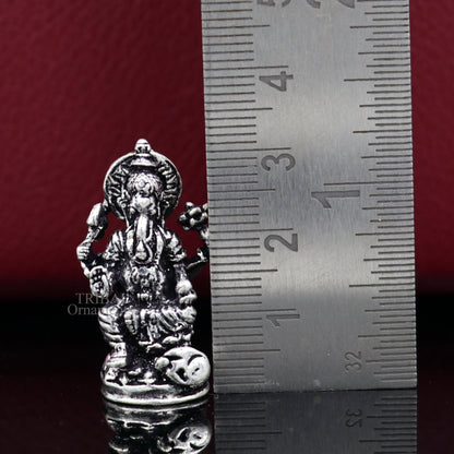 Small Ganesha statue crafted from sterling silver, ideal for home temple or car decor, by TRIBAL ORNAMENTS.
