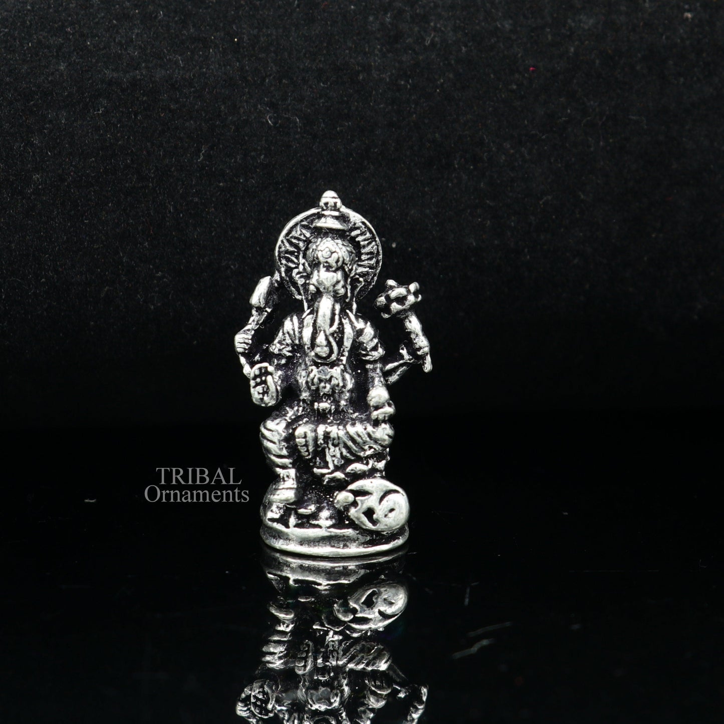 Small Divine Ganesha statue made of 925 sterling silver by Tribal Ornaments, ideal for home temple or car decor.