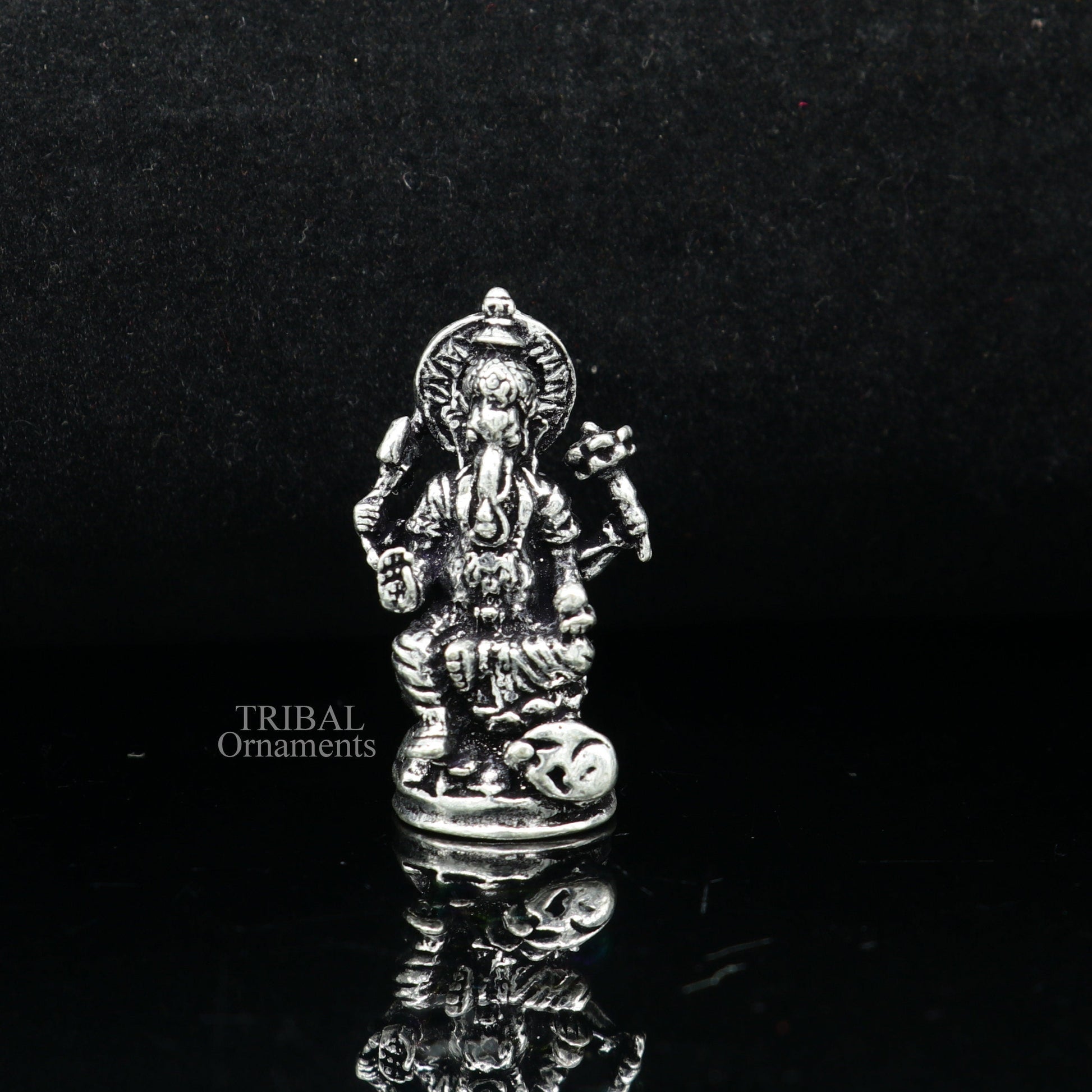 Small Divine Ganesha statue made of 925 sterling silver by Tribal Ornaments, ideal for home temple or car decor.