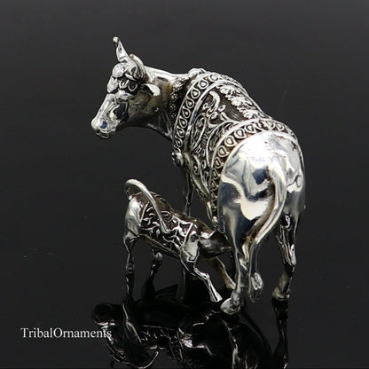 Silver Nakshi work divine cow with calf, vintage Kamdhenu deity sculpture, detailed worshipping cow art in sterling silver by Tribal Ornaments.