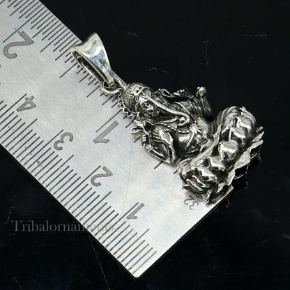 Sterling silver Ganesha pendant featuring Lord Ganesha sitting on a lotus, handcrafted Indian jewelry by Tribal Ornaments