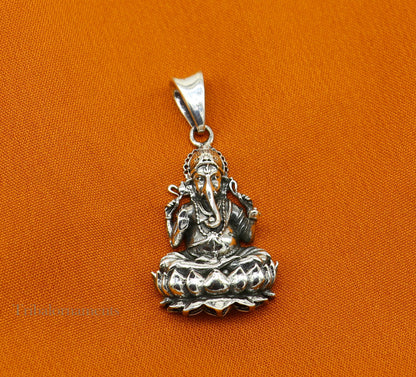 Sterling silver Ganesha pendant with lotus design, handcrafted Indian jewelry by Tribal Ornaments, detailed divine blessing motif