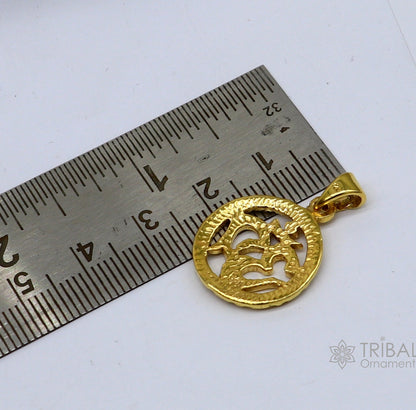 Sterling silver OM 'AUM' pendant by Tribal Ornaments, unisex gold-polished pendant with intricate design and spiritual symbolism.