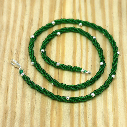 Elegant custom necklace by TRIBAL ORNAMENTS featuring silver semi-precious green beads and triple silver chain design.