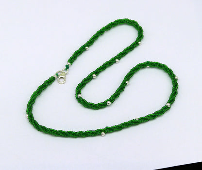 Elegant custom galaxy necklace by TRIBAL ORNAMENTS featuring silver semi-precious green beads and a triple chain design.