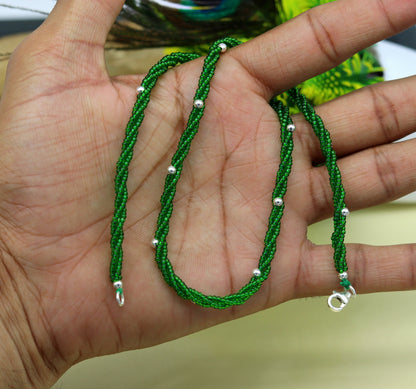 Elegant custom necklace featuring silver semi-precious green beads on a triple chain set in 925 silver, by TRIBAL ORNAMENTS.