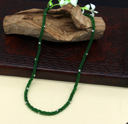 Elegant custom galaxy necklace by TRIBAL ORNAMENTS featuring silver semi-precious green beads on a triple chain in 925 silver.