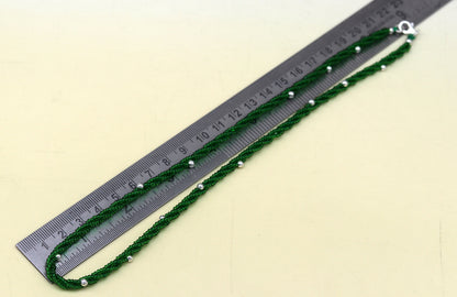 Elegant custom galaxy necklace by TRIBAL ORNAMENTS featuring silver semi-precious green beads on a triple chain in 925 pure silver.