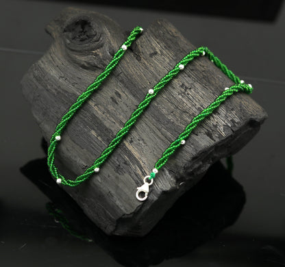 Elegant custom galaxy necklace by TRIBAL ORNAMENTS featuring silver semi-precious green beads on a triple chain set in 925 silver.