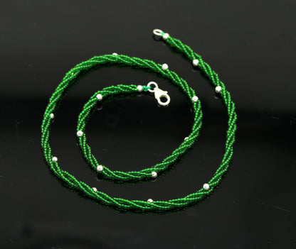Elegant custom TRIBAL ORNAMENTS silver galaxy necklace with green semi-precious beads and triple chain design.