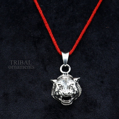 Elegant 925 sterling silver lion face pendant by TRIBAL ORNAMENTS, handcrafted unisex jewelry with intricate tribal design.