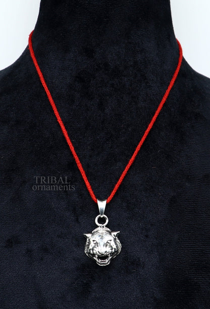 Sterling silver lion face pendant by TRIBAL ORNAMENTS, handcrafted unisex jewelry, detailed lion design for gifting or everyday wear.