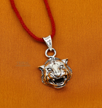 Sterling silver lion face pendant by TRIBAL ORNAMENTS, handcrafted unisex jewelry featuring intricate tribal design.
